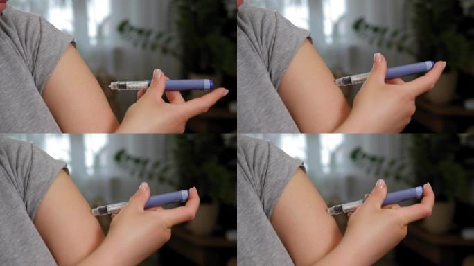 一个年轻女人用胰岛素笔向她的手臂注射胰岛素的特写。