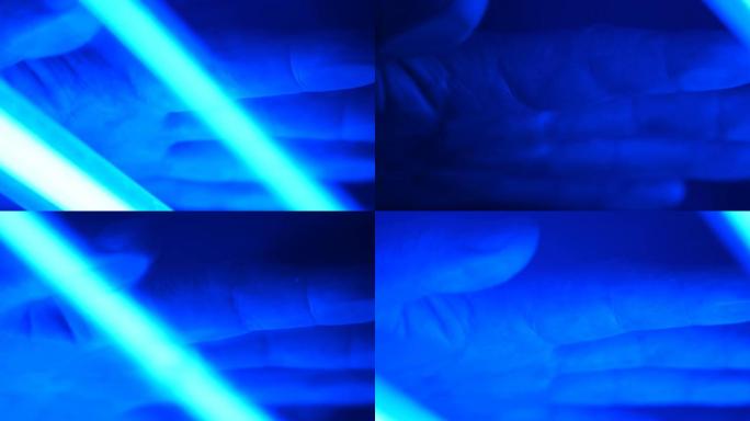移动扫描仪灯的蓝色照明被扫描到男性手掌