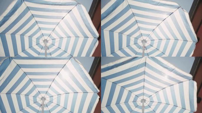 沙滩伞意味着暑假沙滩旅行小雨伞旋转
