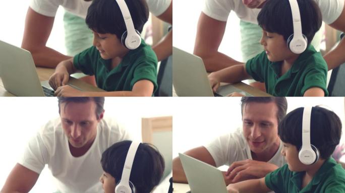 善良的父亲在网上学习期间教儿子。