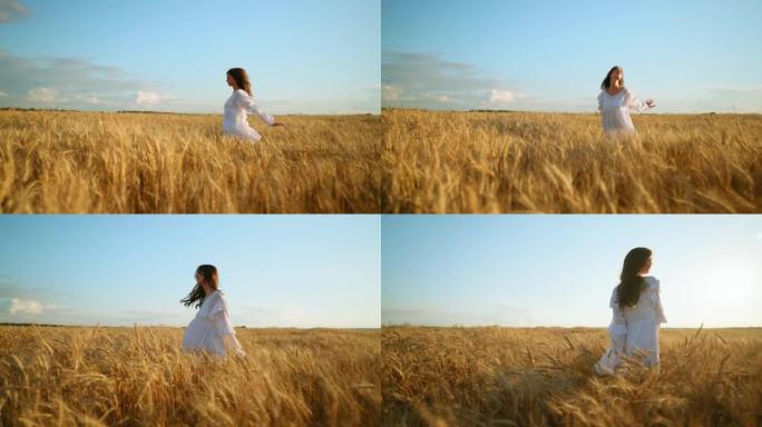 黑发女孩在美丽的黑麦田里奔跑，金色的耳朵，欣赏和启发大自然的美丽