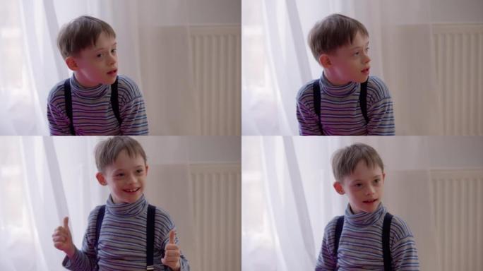 快乐的积极的自闭症男孩在室内坐在家里，竖起大拇指微笑。快乐开朗的高加索孩子的肖像，精神障碍享受休闲微