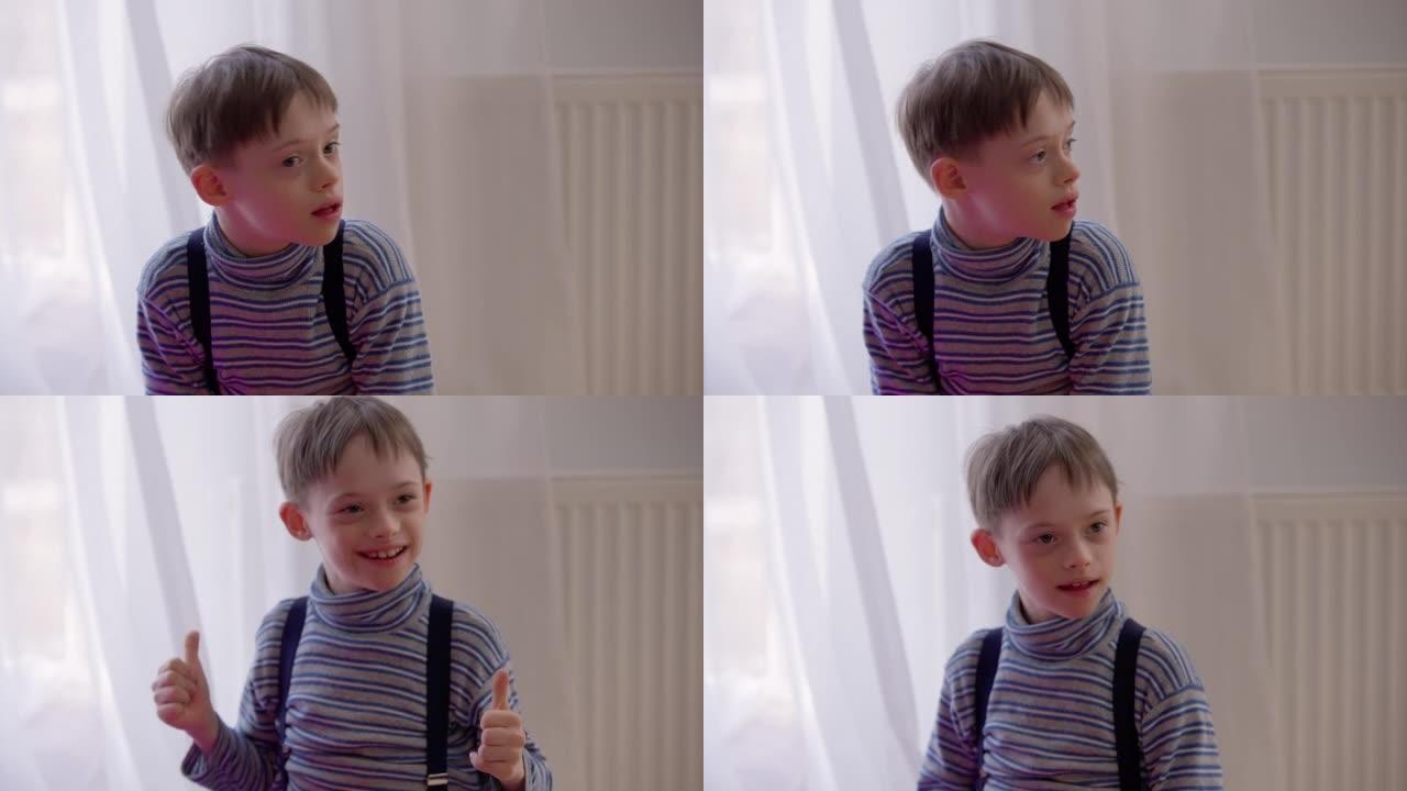 快乐的积极的自闭症男孩在室内坐在家里，竖起大拇指微笑。快乐开朗的高加索孩子的肖像，精神障碍享受休闲微
