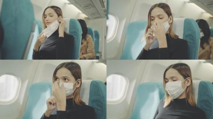 在飞机上戴口罩的女人