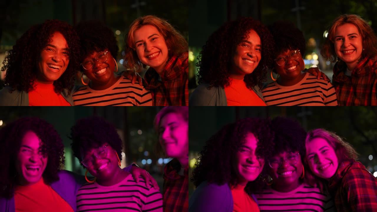 Portrait of happy friends together at night