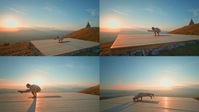 CS男子在日落时在山上举行瑜伽姿势