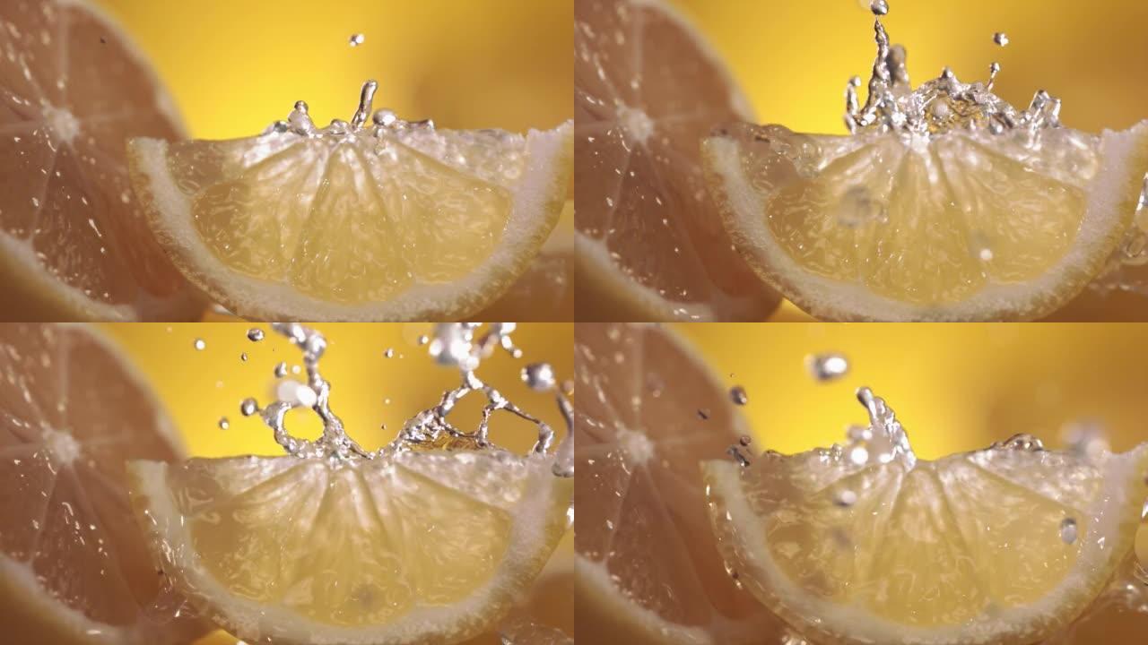 柠檬和水溅过柠檬片的慢动作镜头