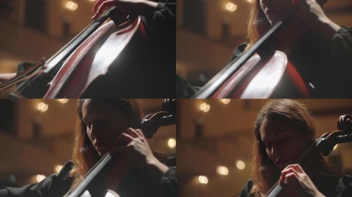女小提琴演奏家正在现场演奏大提琴，大提琴的特写镜头，大提琴的弓和手