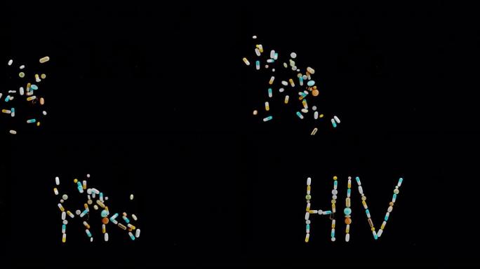 SLO MO LD彩色药丸，片剂和胶囊掉落在黑色表面上，并刻有 “HIV” 字样