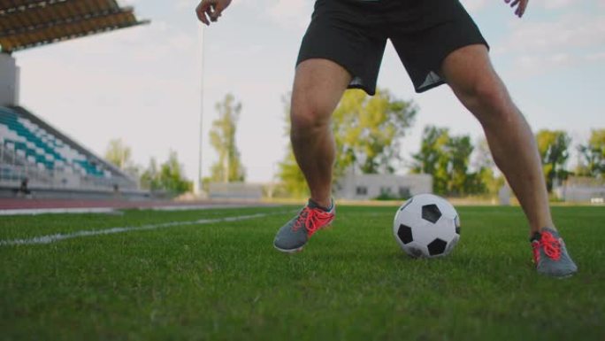 足球运动员展示步法和足球运动员在慢动作中踢球和射门