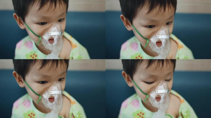 蹒跚学步的男孩通过口罩呼吸吸入治疗过敏