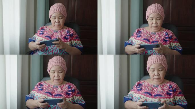 使用智能手机的亚洲癌症高级女性