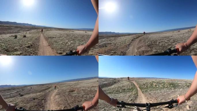 遵循沙漠小径的山地自行车手的第一人称视角