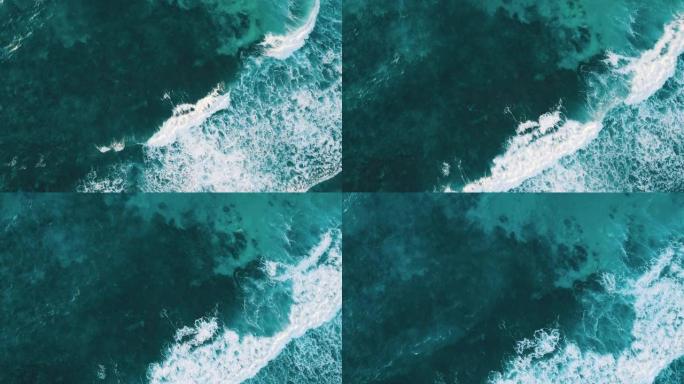 空中无人机拍摄了带有白浪和绿松石水的海洋礁石