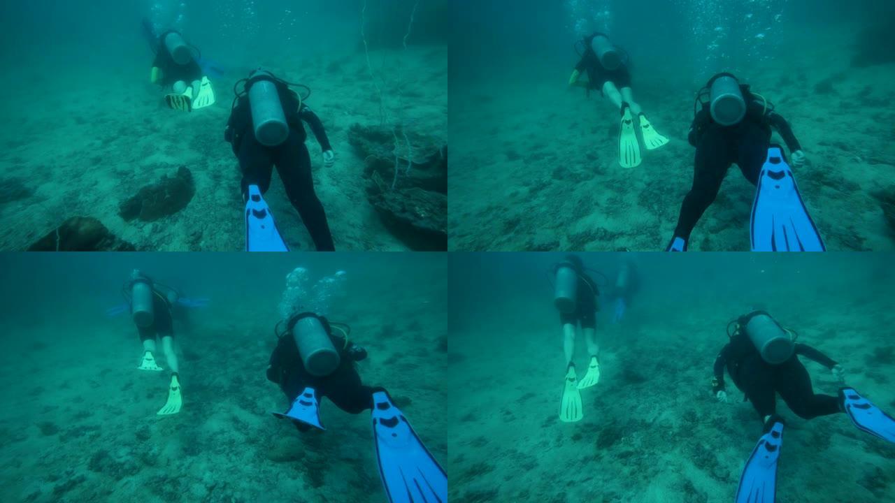 潜水员游泳探索深海