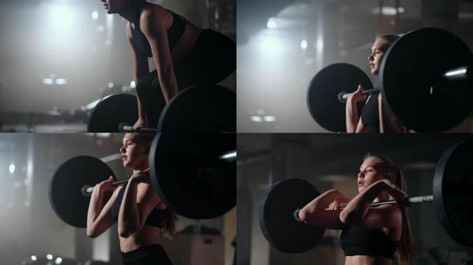 女健美运动员在健身房做举重运动。一名女子举重运动员在黑暗的健身房里进行杠铃举重。女健美运动员在硬核训