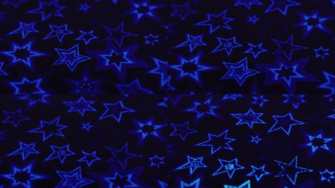 宏观幻灯片拍摄，蓝色的星星和雪花闪烁