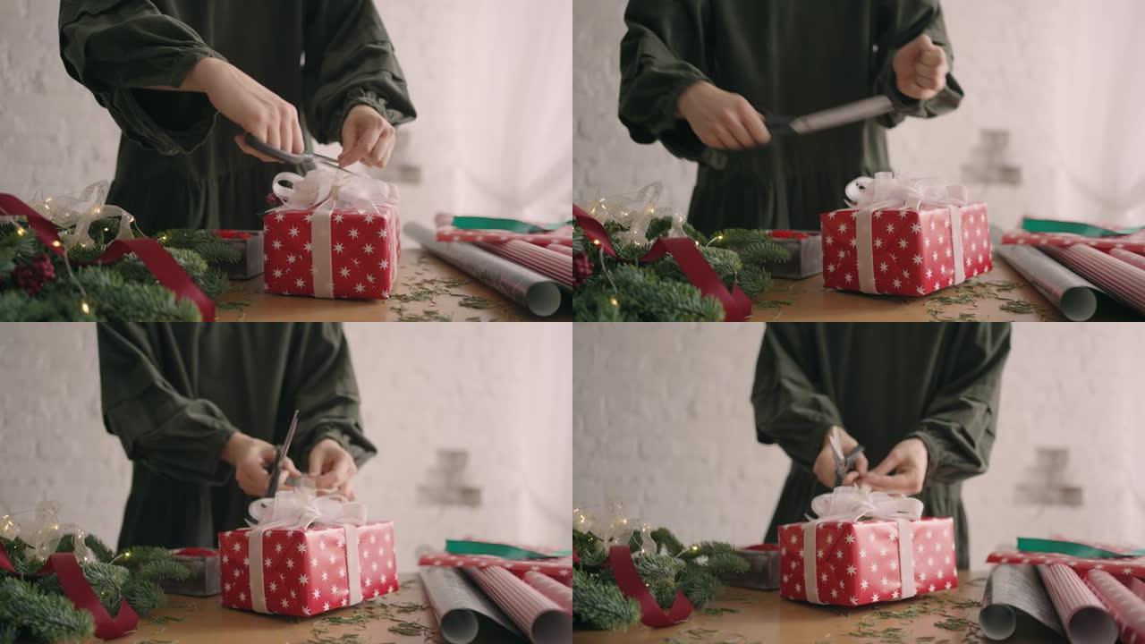 特写: 用绳子装饰包装的盒子。女性在木桌上包装纸板礼品盒，为圣诞节庆祝准备各种装饰物品。