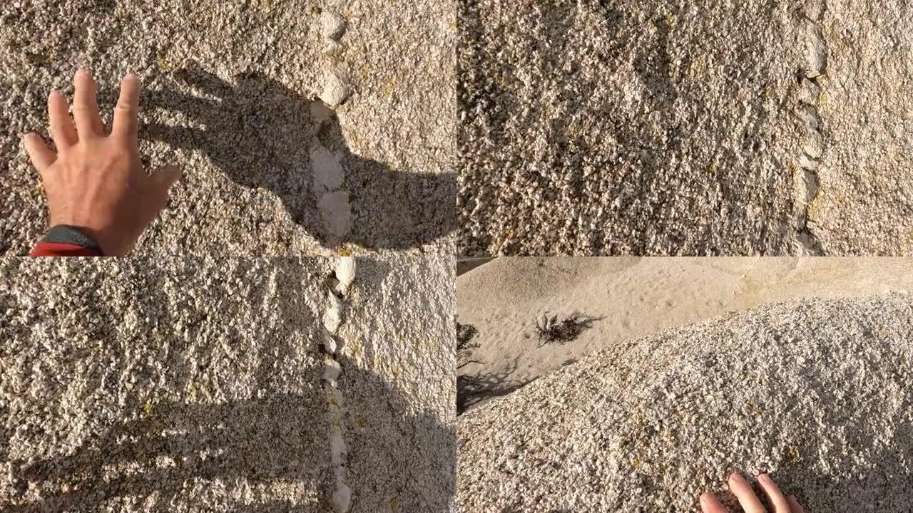 人类手攀登沙漠巨石的细节