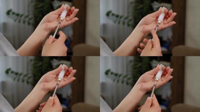 一名妇女将正确剂量的胰岛素拨入注射器的特写镜头。