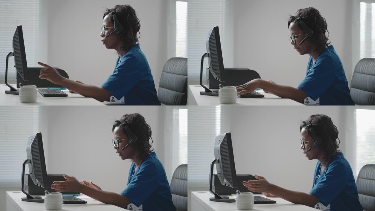 穿着白大褂的非洲裔美国黑人女性全科医生坐在医生办公室的办公桌前，一边滚动电脑鼠标，一边阅读病人的病史