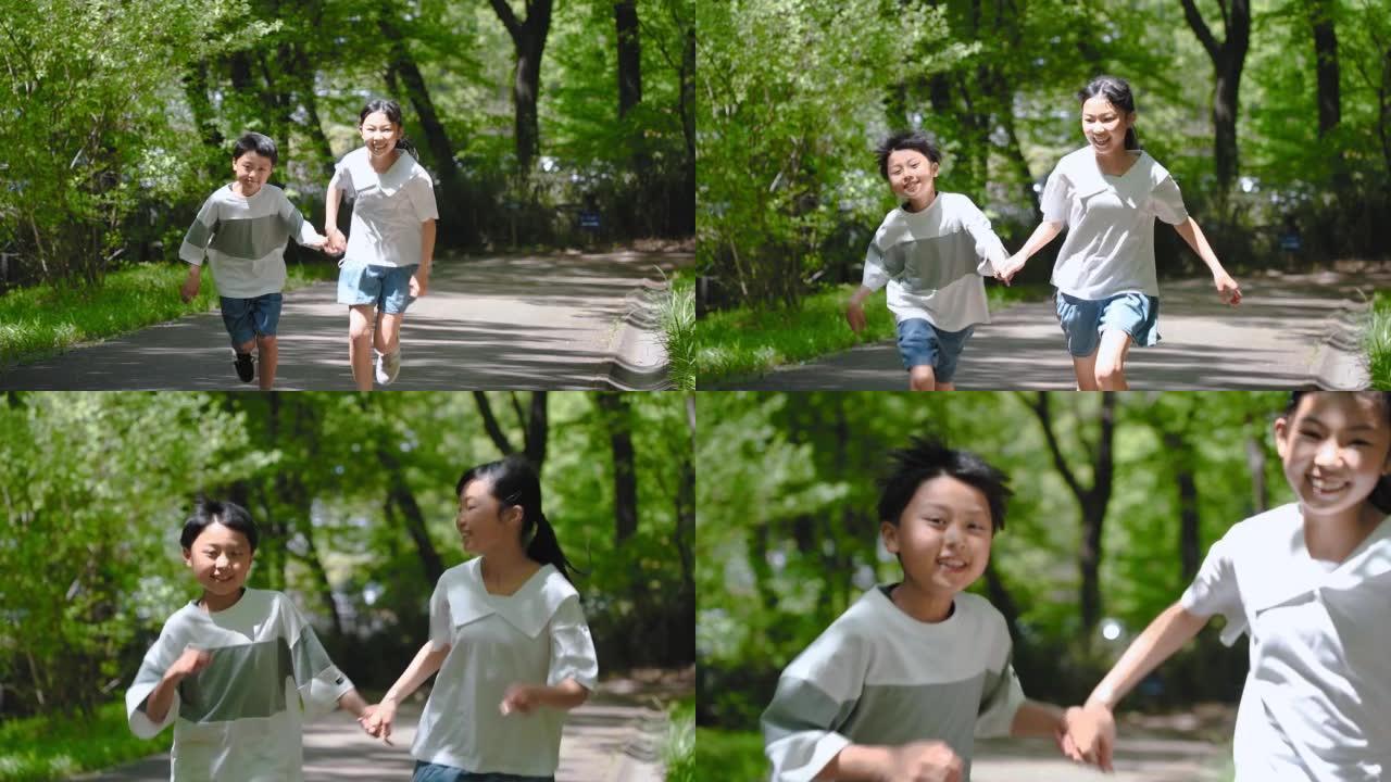 亚洲儿童携手奔跑