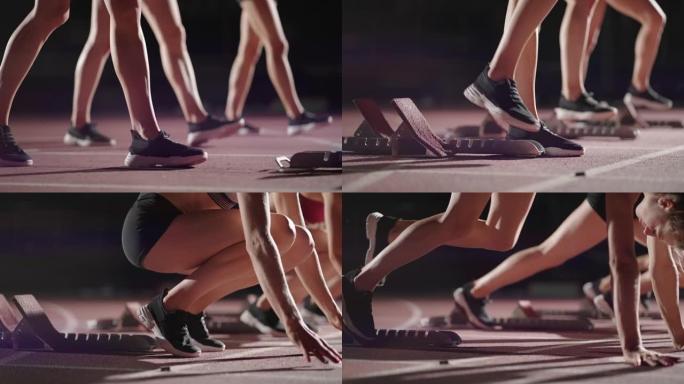 在起跑线附近的黑暗中，穿着运动鞋的女跑步者的腿特写，比赛的准备和准备