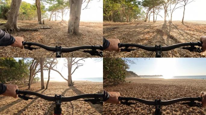 山地自行车在空旷的海滩上的第一人称视角