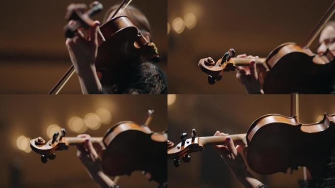 年轻女子手中的小提琴，音乐家在音乐会上演奏小提琴，经典或新古典主义音乐