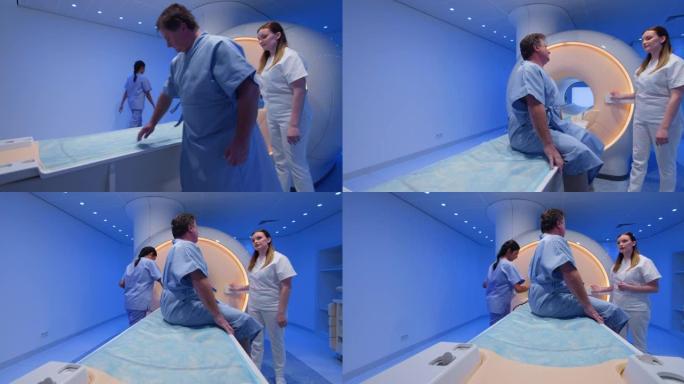 DS女性放射学技术专家在MRI扫描前与男性患者交谈