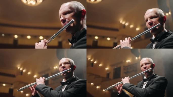 长笛演奏家正在歌剧院或爱乐音乐厅的现场播放音乐，特写肖像