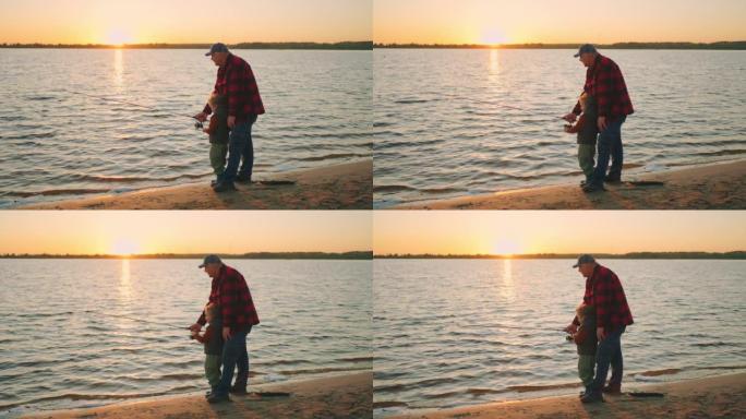 河上美丽的日落，老渔夫和小男孩正在抓鱼，爷爷和孩子正在度过周末