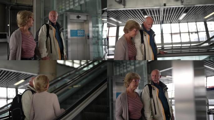 带着行李的高级夫妇在地铁站散步