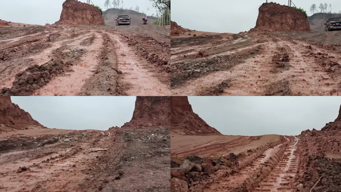 雨后路面开采工地湿滑黄泥路车轮压过的坏路