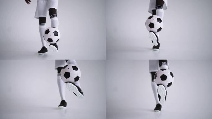 足球保持向上，球员脚踢和持球特写，技术技能