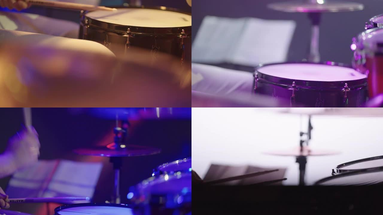 鼓手正在演奏鼓套件，用鼓棒的音乐家手的特写视图，摇滚演出