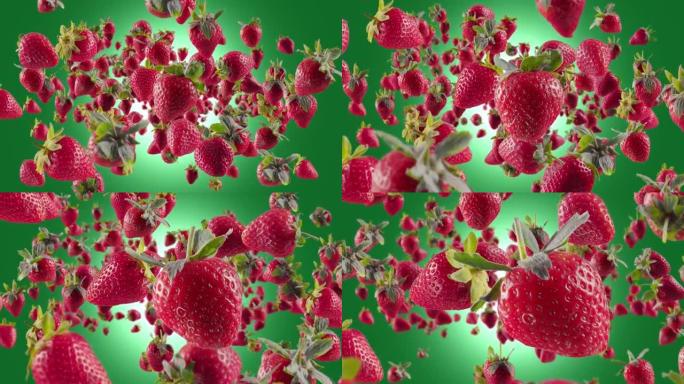 绿色背景下的草莓爆发