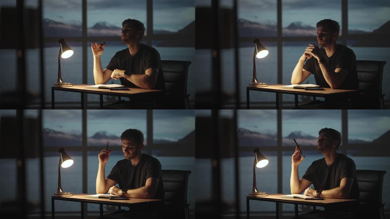 一个体贴的人坐在桌子旁，背景是海洋和大海的窗户。一个不安分的人坐在桌子旁，拿着台灯