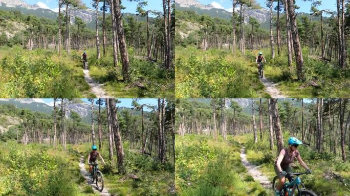 女山地车手在山下下降森林步道