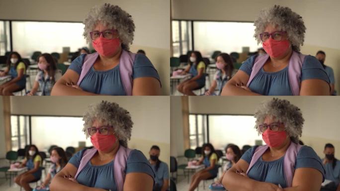教室里使用口罩的老师肖像