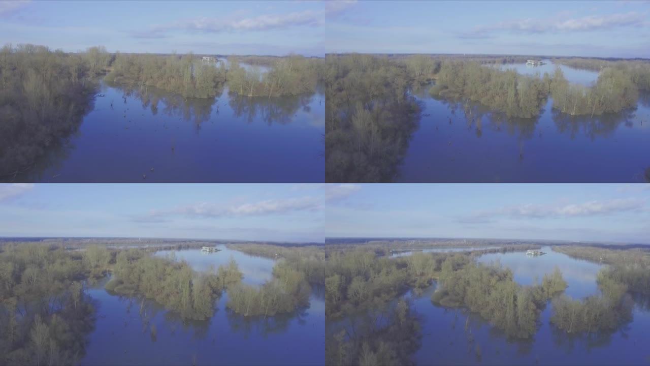 空中无人机在冬季的晴天拍摄湖泊