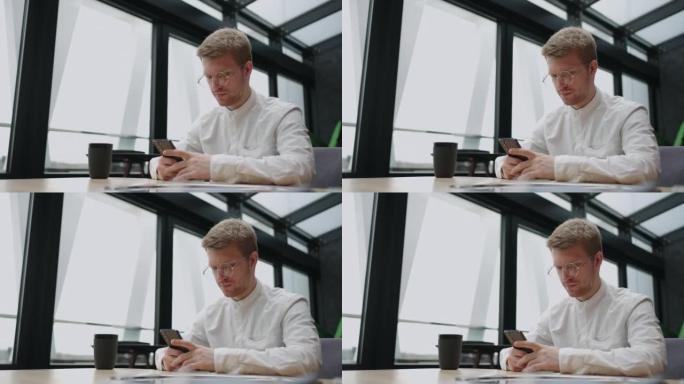 病态的互联网使用和现代人的末日，英俊的欧洲男人正在用智能手机阅读新闻