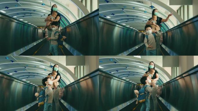 亚洲母亲在机场抱着男婴