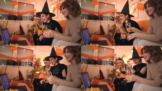 在万圣节派对上，三名穿着服装的年轻女子通过笔记本电脑进行视频通话