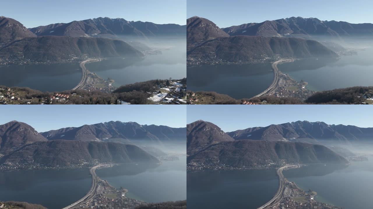 在晴朗的日子里，空中无人机拍摄了一个山湖小镇