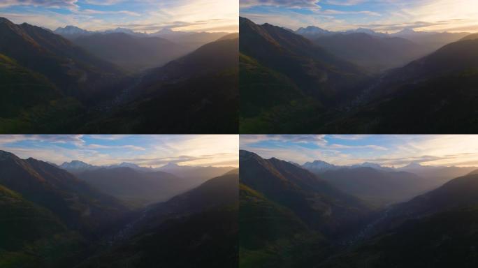 日落时欧洲阿尔卑斯山山谷的鸟瞰图