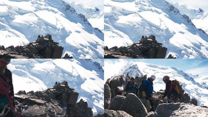 一队登山者在山顶上移动。休息一下。冬季冒险