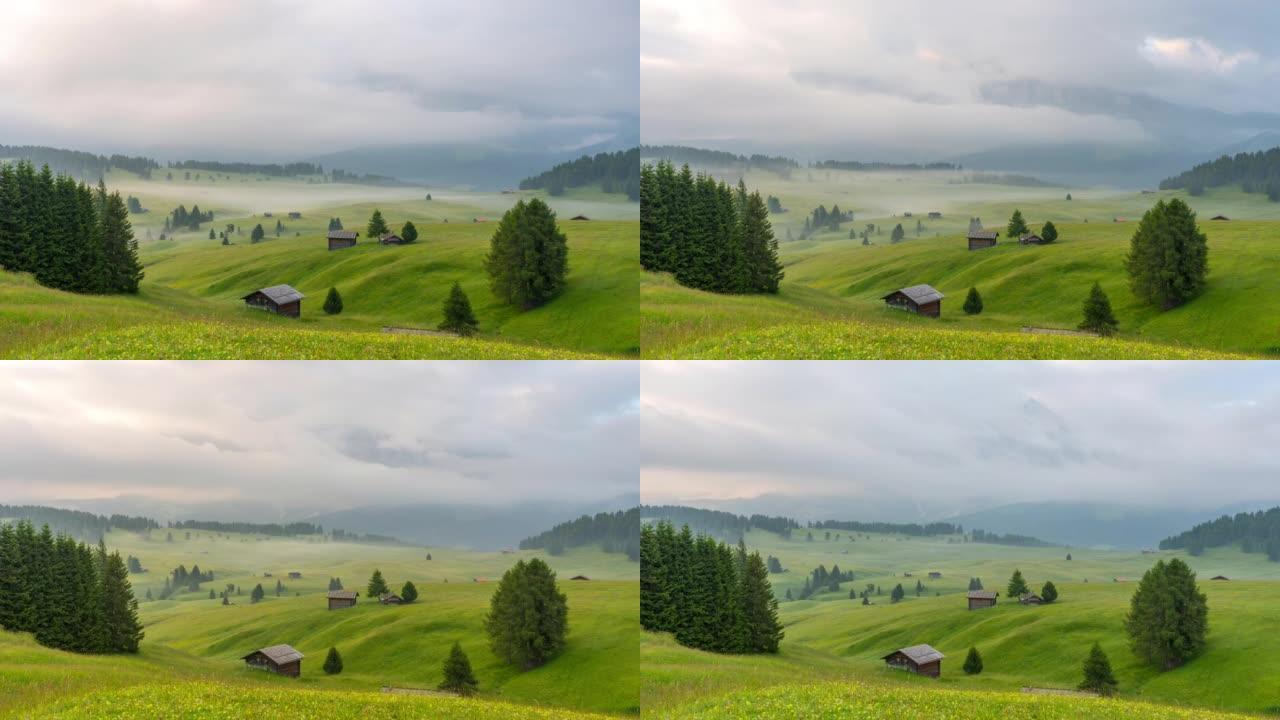 意大利夏季多洛米蒂雄伟的Seiser Alm meadows的延时日出场景与移动的雾和云。南蒂罗尔阿