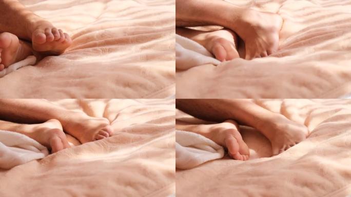 一个躺在床上无法入睡的男人的腿的特写