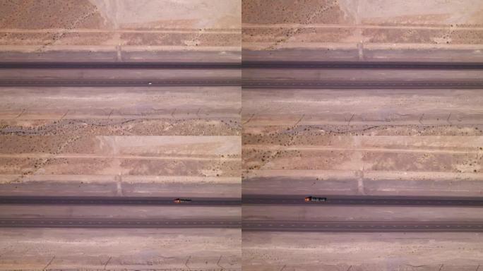 在沙漠上的道路上鸟瞰图。美国西部有汽车的高速公路